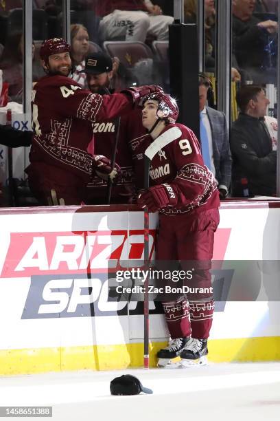 Clayton Keller of the Arizona Coyotes celebrates with Zack Kassian after scoring a hat trick in the third period against the Vegas Golden Knights at...