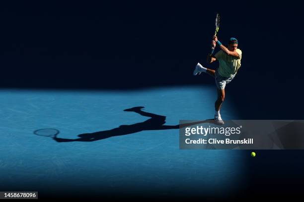 Holger Rune of Denmark plays a backhand in the fourth round singles match against Andrey Rublev of Russia during day eight of the 2023 Australian...