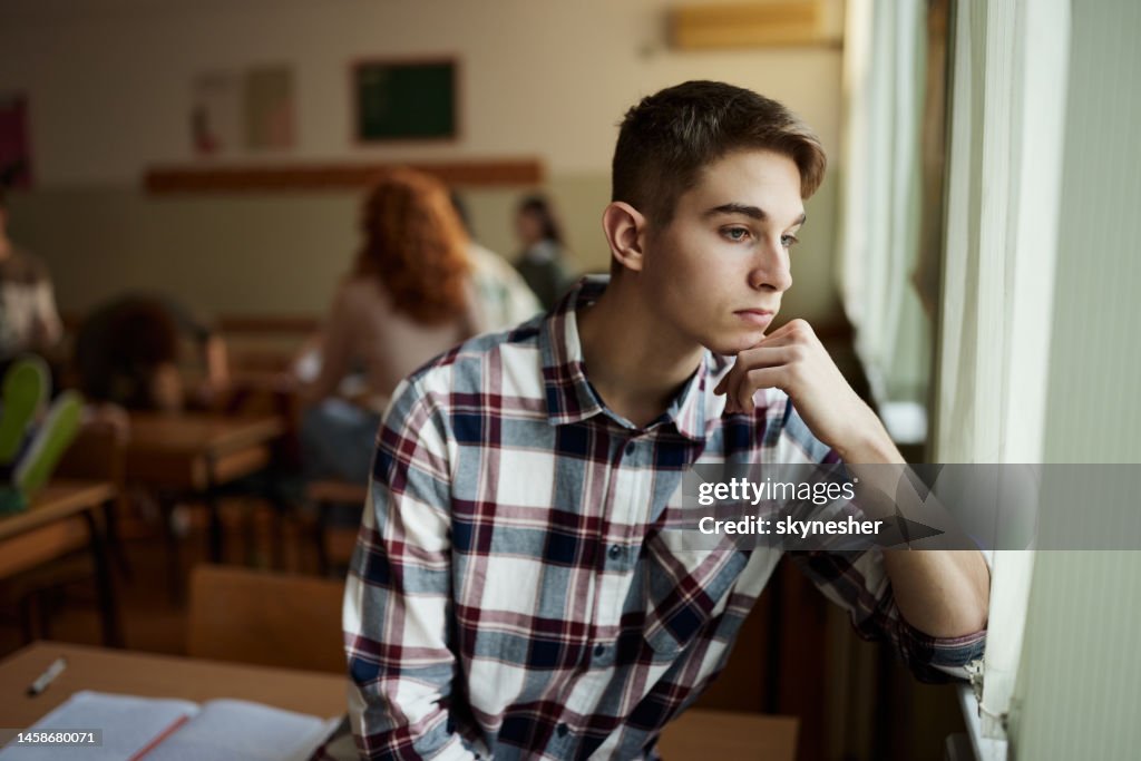 Window Alone Student Thoughtful Male Students Looking Through Window On A Break In The ...