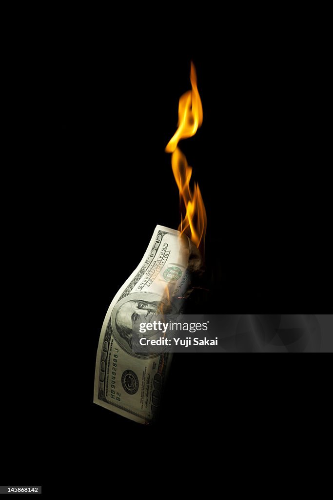 US dollar banknote burning