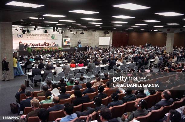 Delegates attend the opening session of the "Rio-92 Earth Summit", 12 June 1992 in the plenary hall of the Rio Centro Convention Centre. A record...