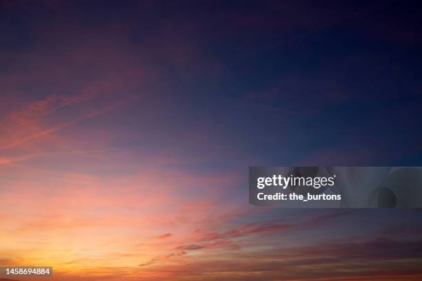 full frame shot of dramatic sky during sunset, abstract background - imbrunire foto e immagini stock