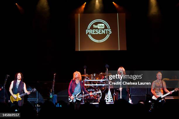 Guitarist Vivian Campbell, bassist Rick Savage, drummer Rick Allen, vocalist Joe Elliott and guitarist Phil Collen of Def Leppard perform at House of...