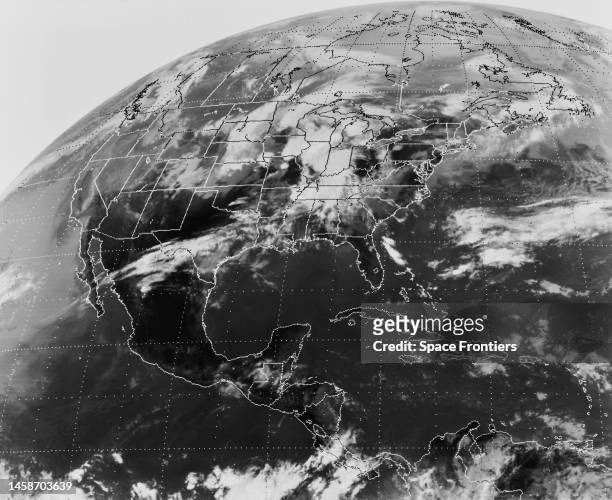 Meteorological satellite view of the Earth showing North America and Central America, with the Pacific Ocean to the east and the Atlantic Ocean to...