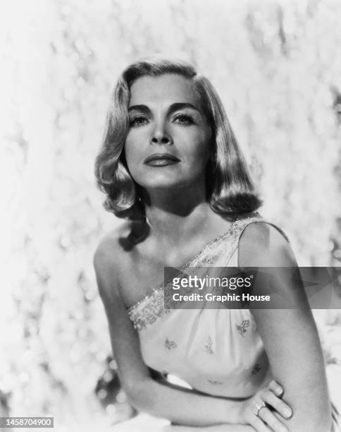 American actress and singer Lizabeth Scott , wearing a one-shoulder outfit, in a publicity portrait, against a white background, United States, circa...