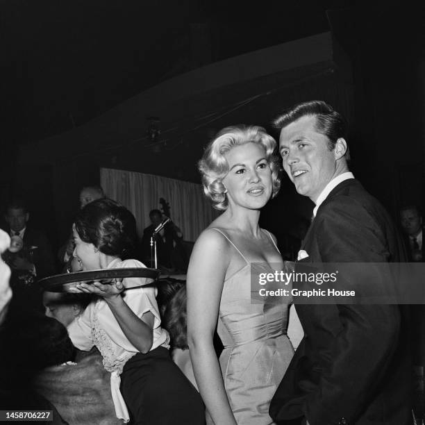 American actress Asa Maynor and American actor Edd Byrnes attend an Hollywood party in Los Angeles, California, 1960.