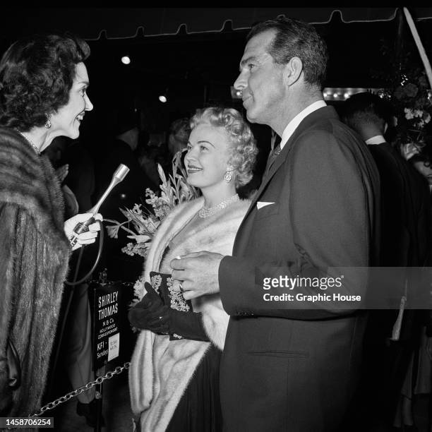 American journalist and actress Shirley Thomas interviewing American actress, singer and dancer June Haver and her husband, American actor Fred...