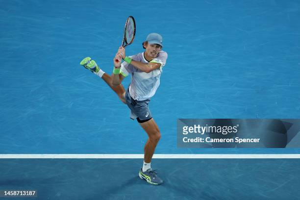 Alex de Minaur of Australia plays a backhand during the fourth round singles match against Novak Djokovic of Serbia during day eight of the 2023...