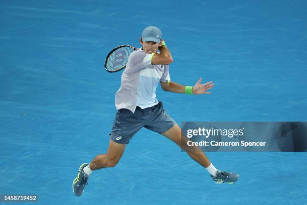 Alex de Minaur of Australia plays a forehand during the fourth round singles match against Novak Djokovic of Serbia during day eight of the 2023...