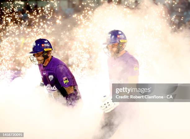Ben McDermott and Caleb Jewel of the Hurricanes head out to bat during the Men's Big Bash League match between the Hobart Hurricanes and the Sydney...