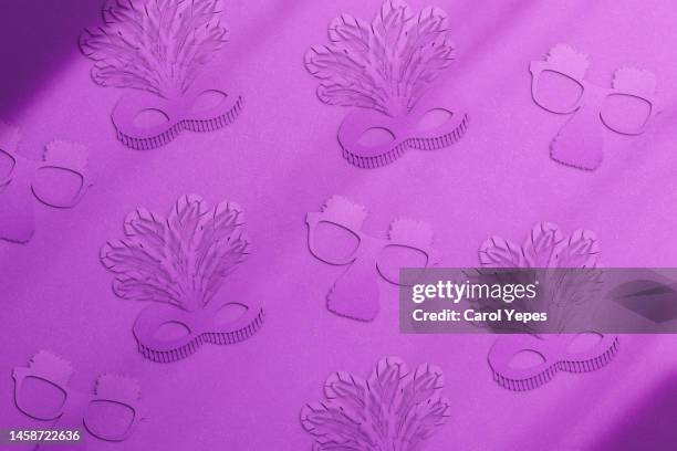 carnival masks.purple background - april fools background stock pictures, royalty-free photos & images