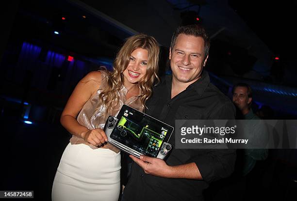 Singer Jennifer Akerman and Wikipad CEO James Bower attend the VIP red carpet cocktail party hosted by WIKIPAD and NVIDIA as part of the celebrations...