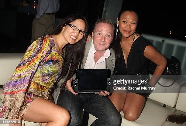 Attorney Joyce Chow, WikiPad President of Sales, Fraser Townley, and actress Cassandra Hepburn arrive at the VIP red carpet cocktail party hosted by...