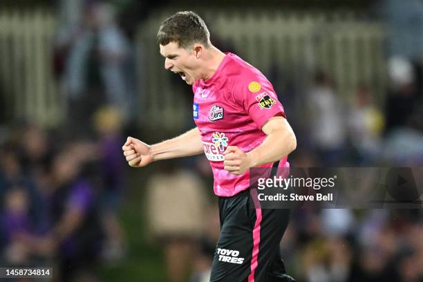 Hayden Kerr of the Sixers celebrates the wicket of D'Arcy Short of the Hurricanes during the Men's Big Bash League match between the Hobart...