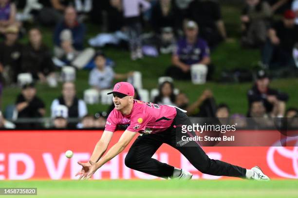 Jackson Bird of the Sixers dives to for a catch during the Men's Big Bash League match between the Hobart Hurricanes and the Sydney Sixers at...