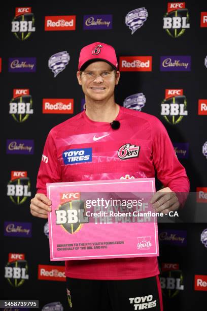 Steven Smith of the Sixers poses with the player of the match award during the Men's Big Bash League match between the Hobart Hurricanes and the...