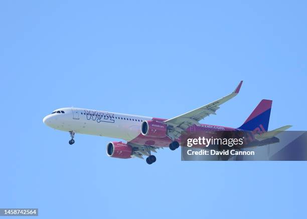 Wizz Air Airbus 320 on approach to the Abu Dhabi International airport flies over the course during the final round on day four of the Abu Dhabi HSBC...