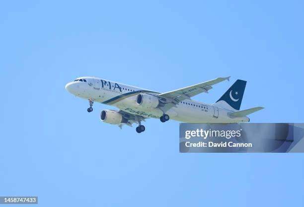 Pakistan International Airways Airbus A320 on approach to the Abu Dhabi International airport flies over the course during the final round on day...