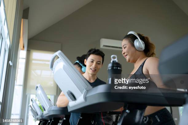 group of women are going to work out at the gym. - fat asian man stock pictures, royalty-free photos & images