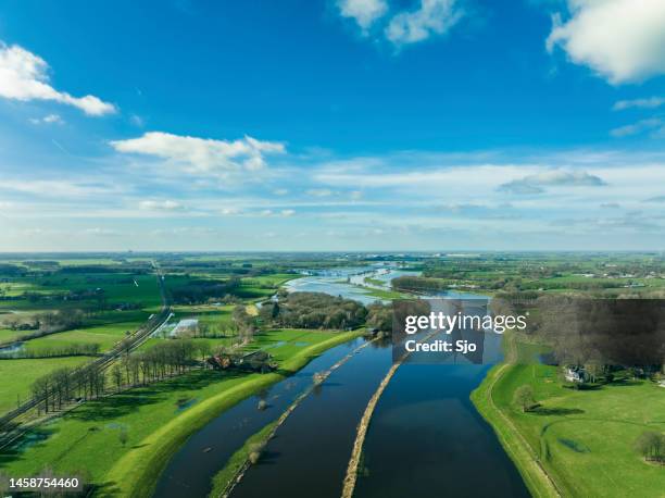 vecht river high water level flooding at the vilsteren weir drone view - overijssel stock pictures, royalty-free photos & images