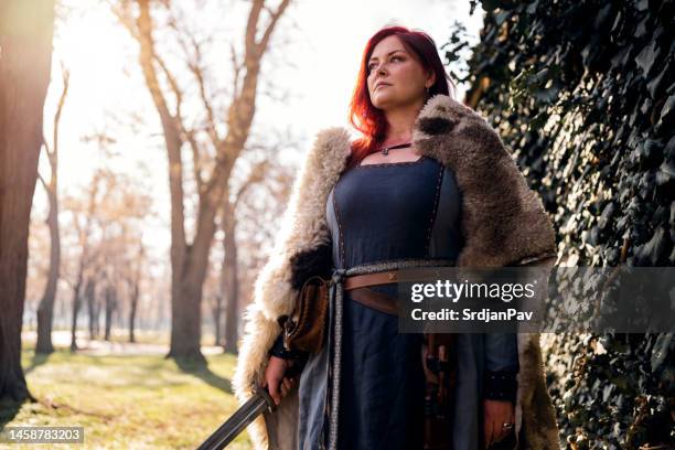medieval female warrior in the forest - ancient female warriors stock pictures, royalty-free photos & images