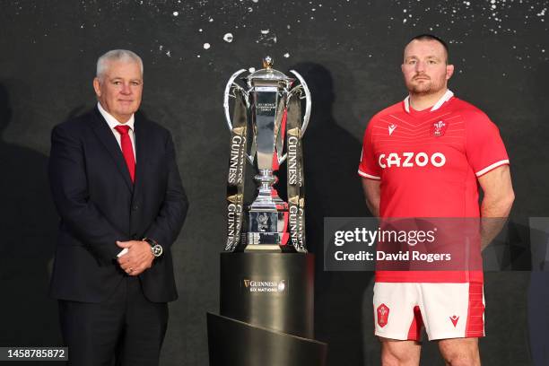 Warren Gatland, Head Coach of Wales and Ken Owens, Captain of Wales pose alongside the Guinness Six Nations trophy during the 2023 Guinness Six...