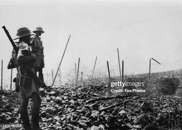 British troops inspect a breach in Tegart's Wall, a barbed wire fence between the Upper Galilee in Mandatory Palestine and Lebanon and Syria , 13th...