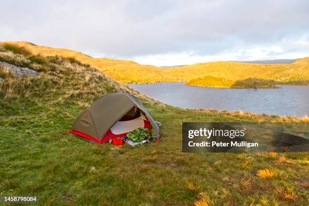 tent pitched by angle tarn in the english lake district - valley side stock pictures, royalty-free photos & images