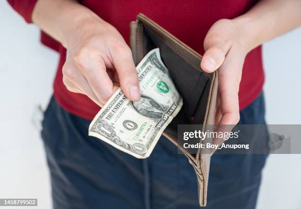 cropped shot of someone open her wallet and found only one dollar bill. - dollar stock pictures, royalty-free photos & images