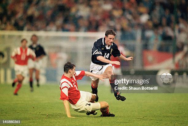 Kevin Gallacher of Scotland is tackled by Andrei Chernyshov of USSR during the UEFA European Championships 1992 Group 2 match between USSR and...