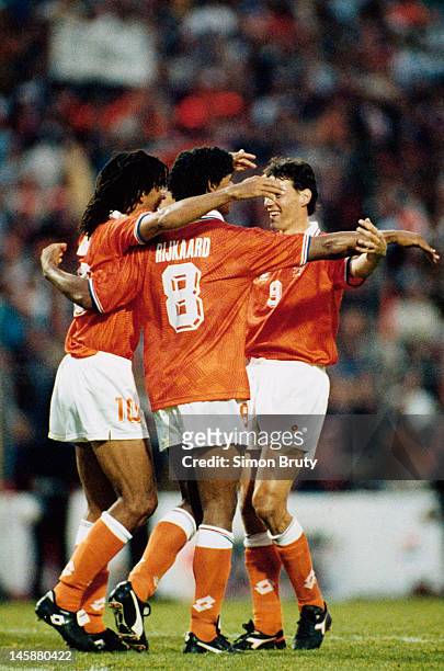 The AC Milan contingent of Ruud Gullit, Frank Rijkaard and Marco van Basten of Netherlands celebrate a famous victory at full time during the UEFA...