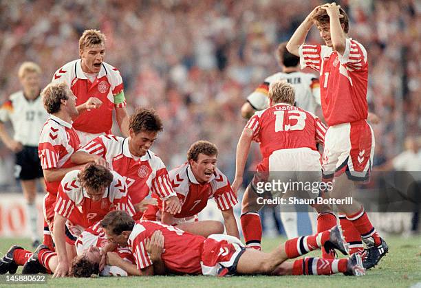 Kim Vilfort of Denmark is mobbed by team-mates after scoring the second and winning goal during the UEFA European Championships 1992 Final between...