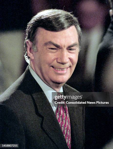 Close-up of American journalist & White House Correspondent Sam Donaldson waits for the beginning of a press conference in the White House's East...