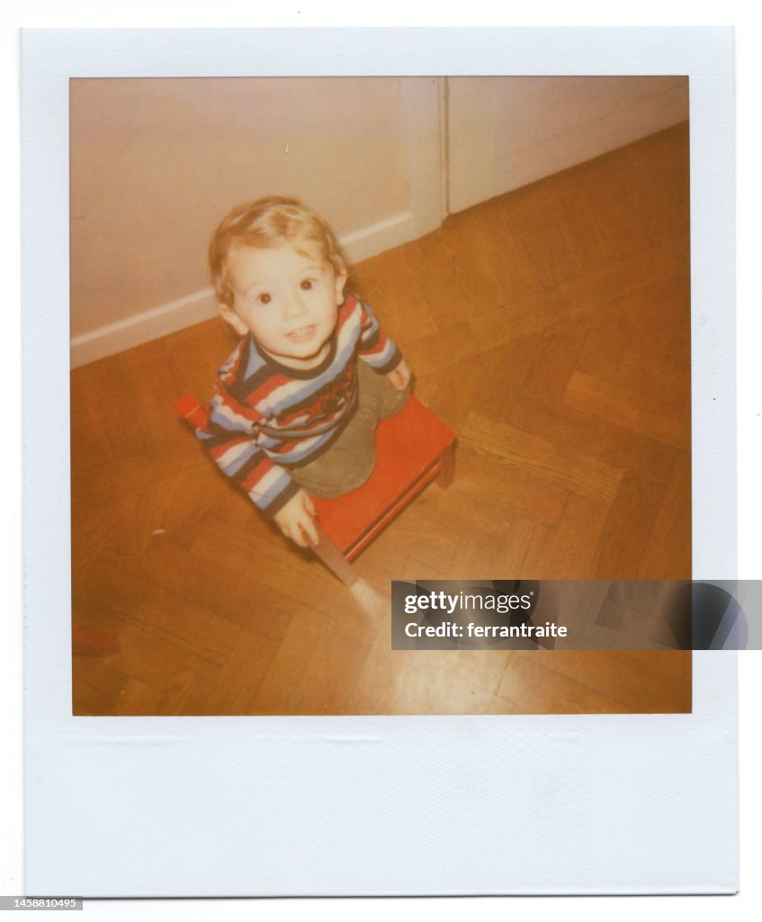 Toddler climbing on a chair