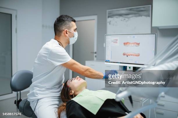 scanning patient's teeth with a modern 3d dental scanner. - medical scanning equipment stock pictures, royalty-free photos & images