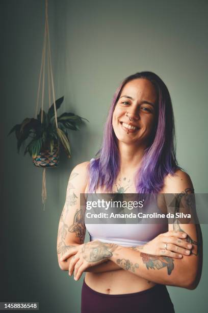 portrait of a yoga practitioner with purple hair - amanda long stock pictures, royalty-free photos & images