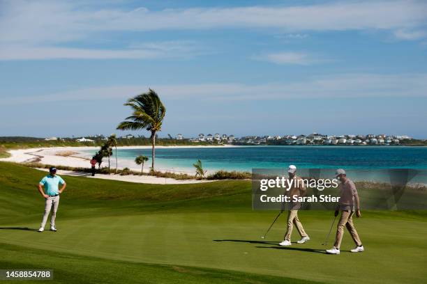 Grayson Murray, Zack Fischer, and Brandon Crick walk on the fifth green during the second round of The Bahamas Great Abaco Classic at The Abaco Club...