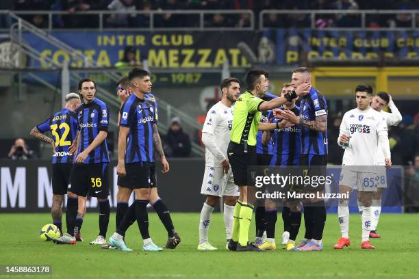 Referee Antonio Rapuano shows a red card to Milan Skriniar of FC Internazionale during the Serie A match between FC Internazionale and Empoli FC at...