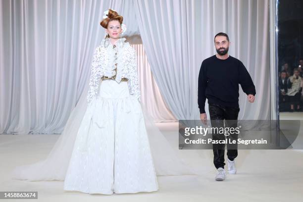 Model Marina Ruy Barbosa and Designer Giambattista Valli walk on the runway after the Giambattista Valli Haute Couture Spring Summer 2023 show as...