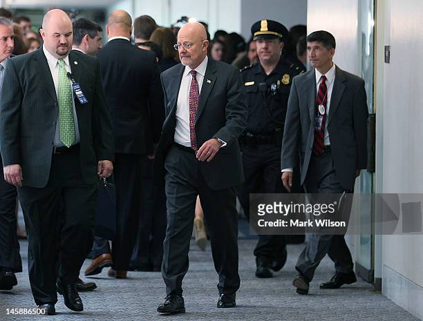 Director of National Intelligence James R. Clapper leaves a joint closed door meeting with the Senate and House Intelligence Committee on Capitol...