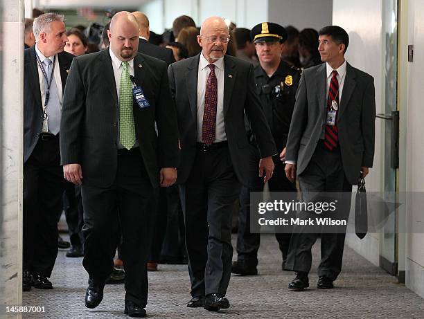 Director of National Intelligence James R. Clapper leaves a joint closed door meeting with the Senate and House Intelligence Committee on Capitol...
