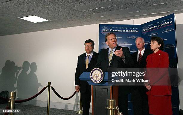 Rep. Mike Rogers speaks to the media while flanked by U.S. Rep. Dutch Ruppersberger , U.S. Sen. Saxby Chambliss and U.S. Sen. Dianne Feinstein after...