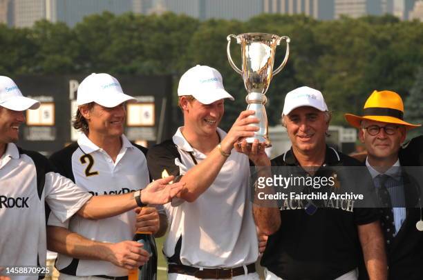 Prince Harry of Wales and polo players after Veuve Cliquot's third annual Polo Classic on Governor's Island.