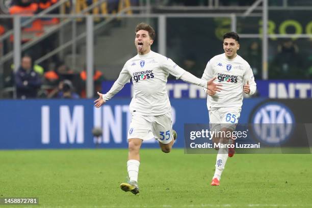 Tommaso Baldanzi celebrates with Fabiano Parisi of Empoli FC after scoring the team's first goal during the Serie A match between FC Internazionale...