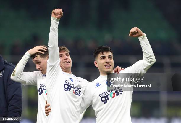 Tommaso Baldanzi and Fabiano Parisi of Empoli FC celebrate with the fans after the team's victory during the Serie A match between FC Internazionale...