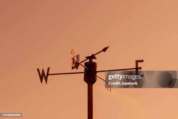 wind vane - east stock pictures, royalty-free photos & images