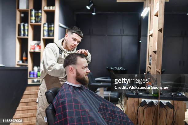 side view of haircut in progress in barber shop - hair color saloon stock pictures, royalty-free photos & images
