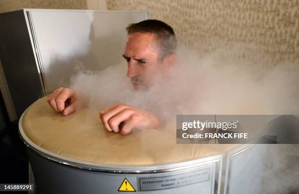 France's national football team Franck Ribery is pictured in a medical engine used for cryotherapy at the training center in Kircha on June 7 on the...