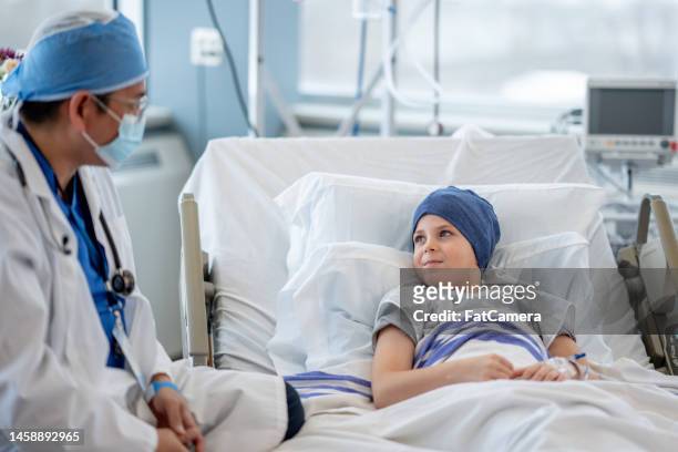 doctor vising a little cancer patient - child cancer stock pictures, royalty-free photos & images