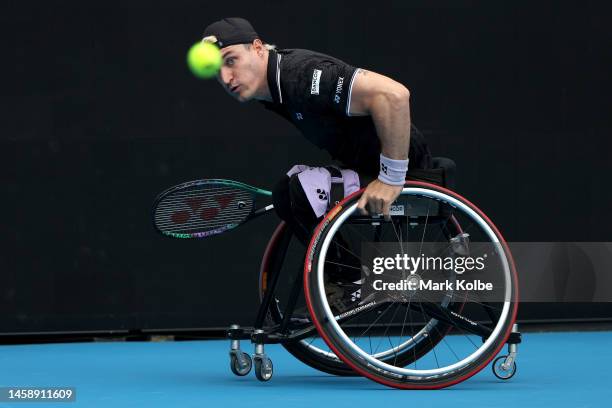 Gustavo Fernandez of Argentina attempts to play a shot in his Men's Wheelchair Singles match against Ruben Spaargaren of the Netherlands during day...